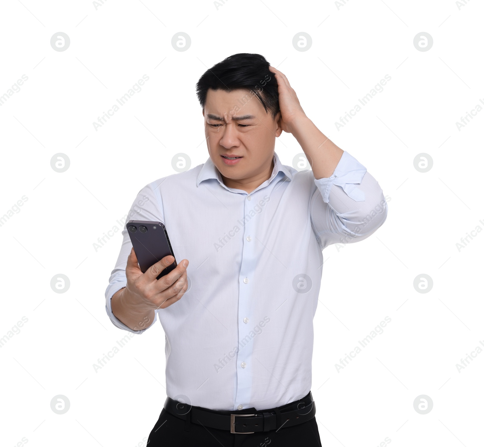 Photo of Confused businessman in formal clothes with phone on white background