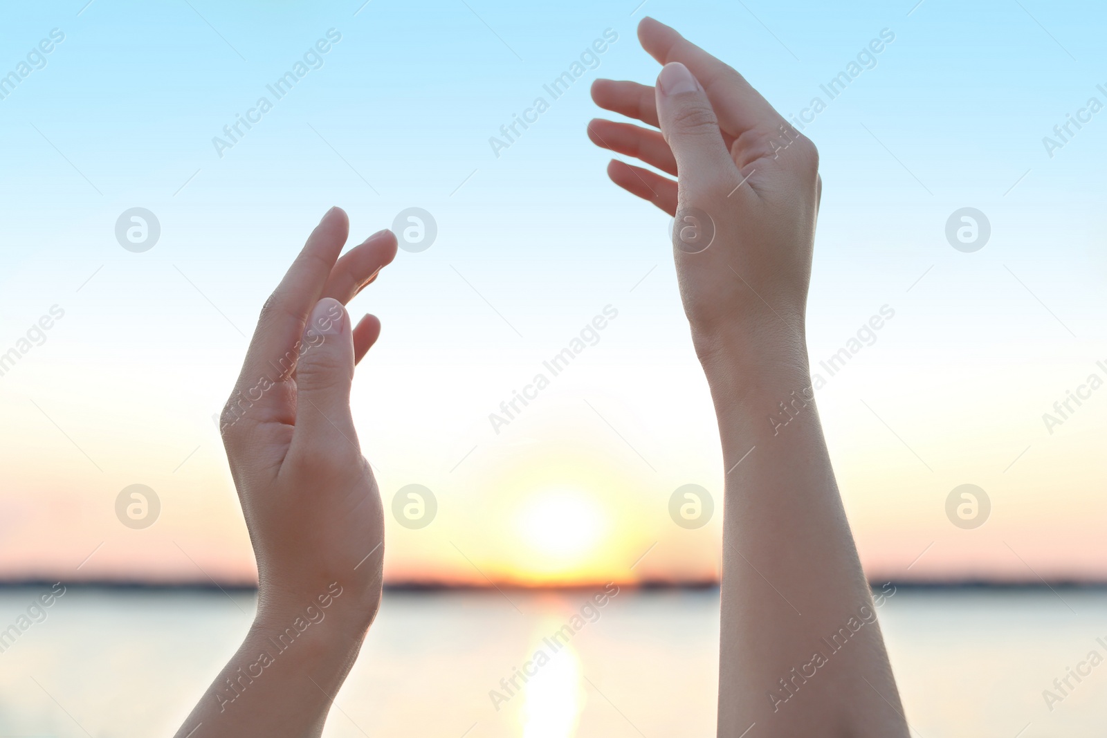 Photo of Woman enjoying beautiful sunset outdoors, closeup view