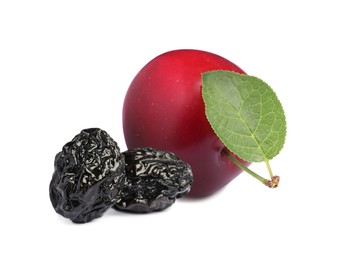 Image of Delicious fresh ripe plum and sweet dried prunes on white background 