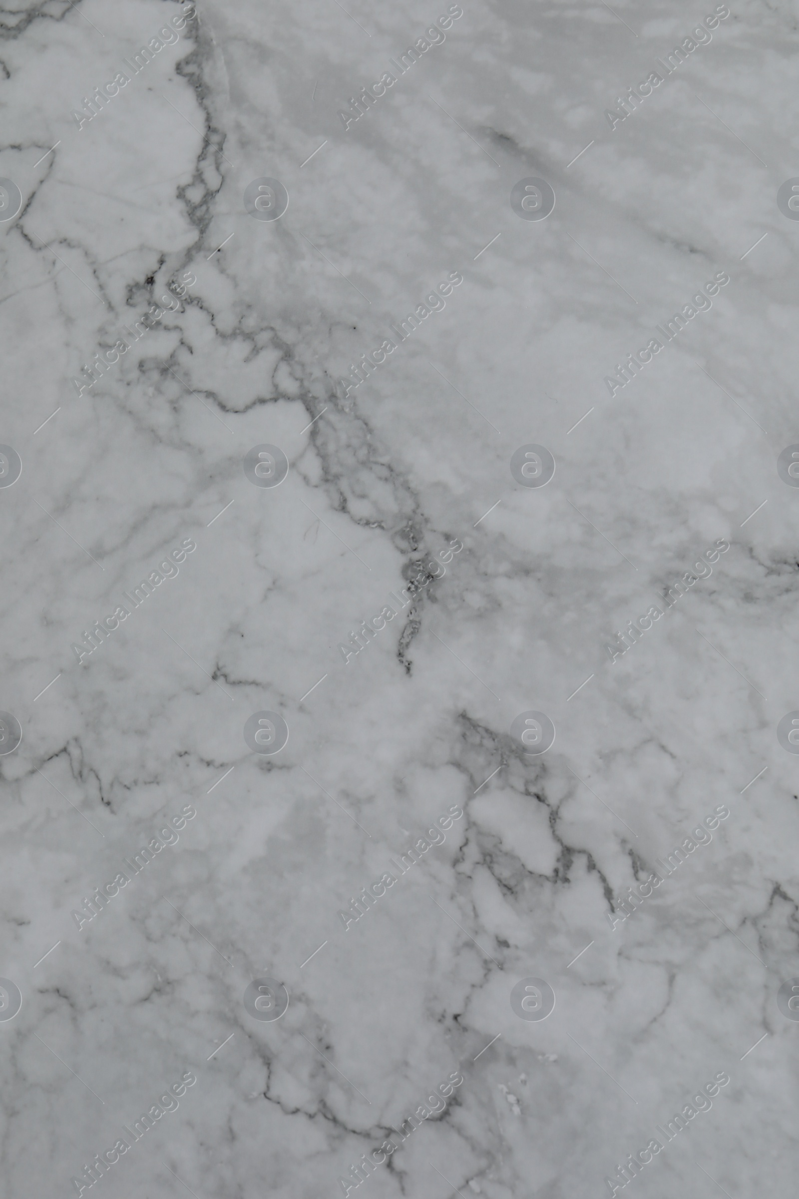 Photo of Texture of light grey marble surface as background, closeup