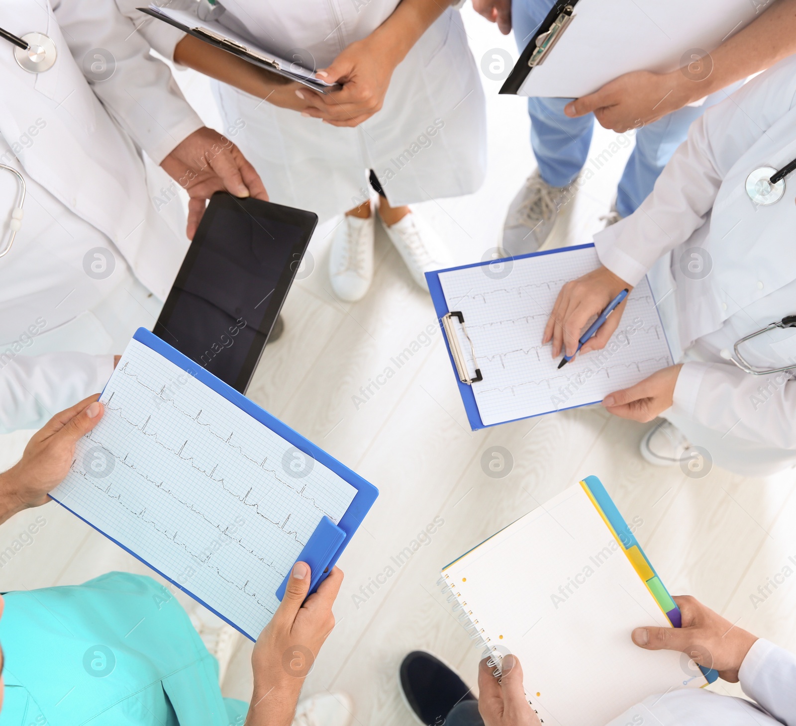 Photo of Group of doctors attending meeting in clinic. Cardiology conference