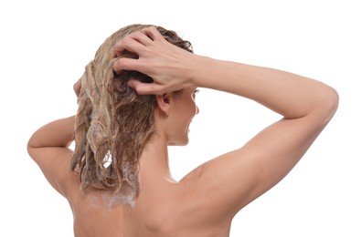 Photo of Woman washing hair with shampoo on white background