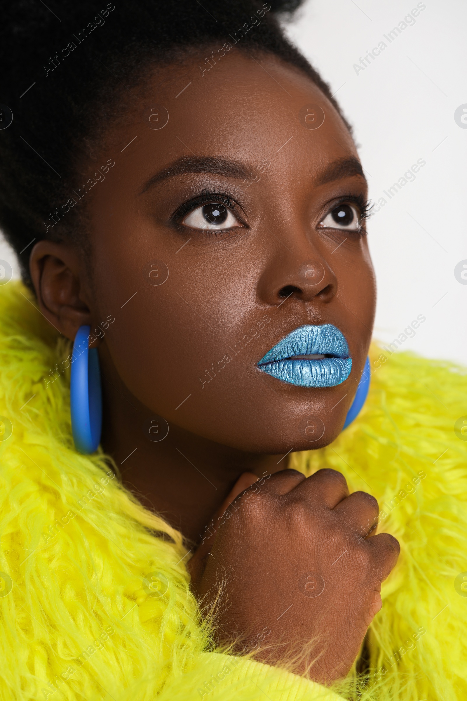 Photo of Fashionable portrait of beautiful woman with bright makeup on white background, closeup