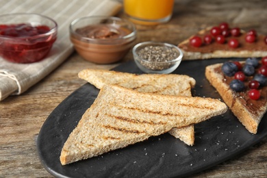 Freshly toasted slices of bread on board