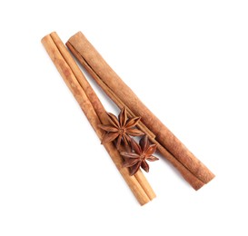 Cinnamon sticks and anise stars isolated on white, top view