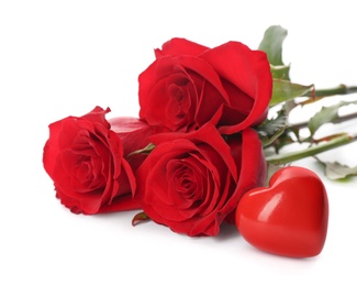 Photo of Beautiful red roses and heart on white background. St. Valentine's day celebration