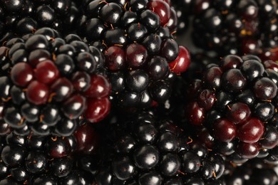 Photo of Many tasty ripe blackberries as background ,closeup