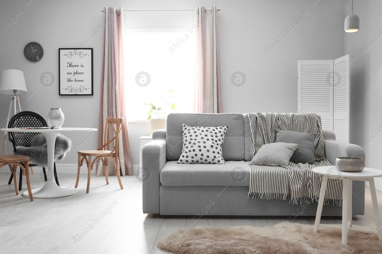 Photo of Stylish living room interior with comfortable couch