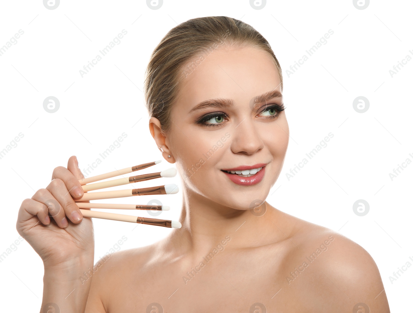 Photo of Beautiful woman with makeup brushes on white background