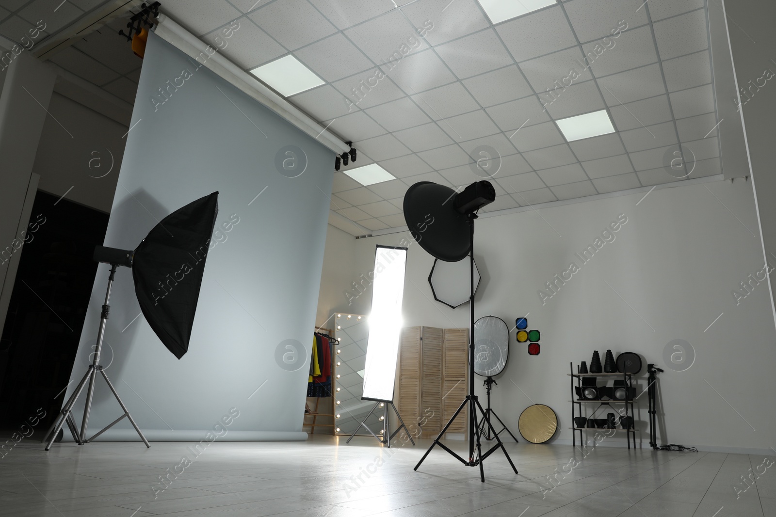 Photo of Interior of modern photo studio with professional equipment