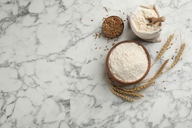 Photo of Flat lay composition with wheat flour on white marble table. Space for text