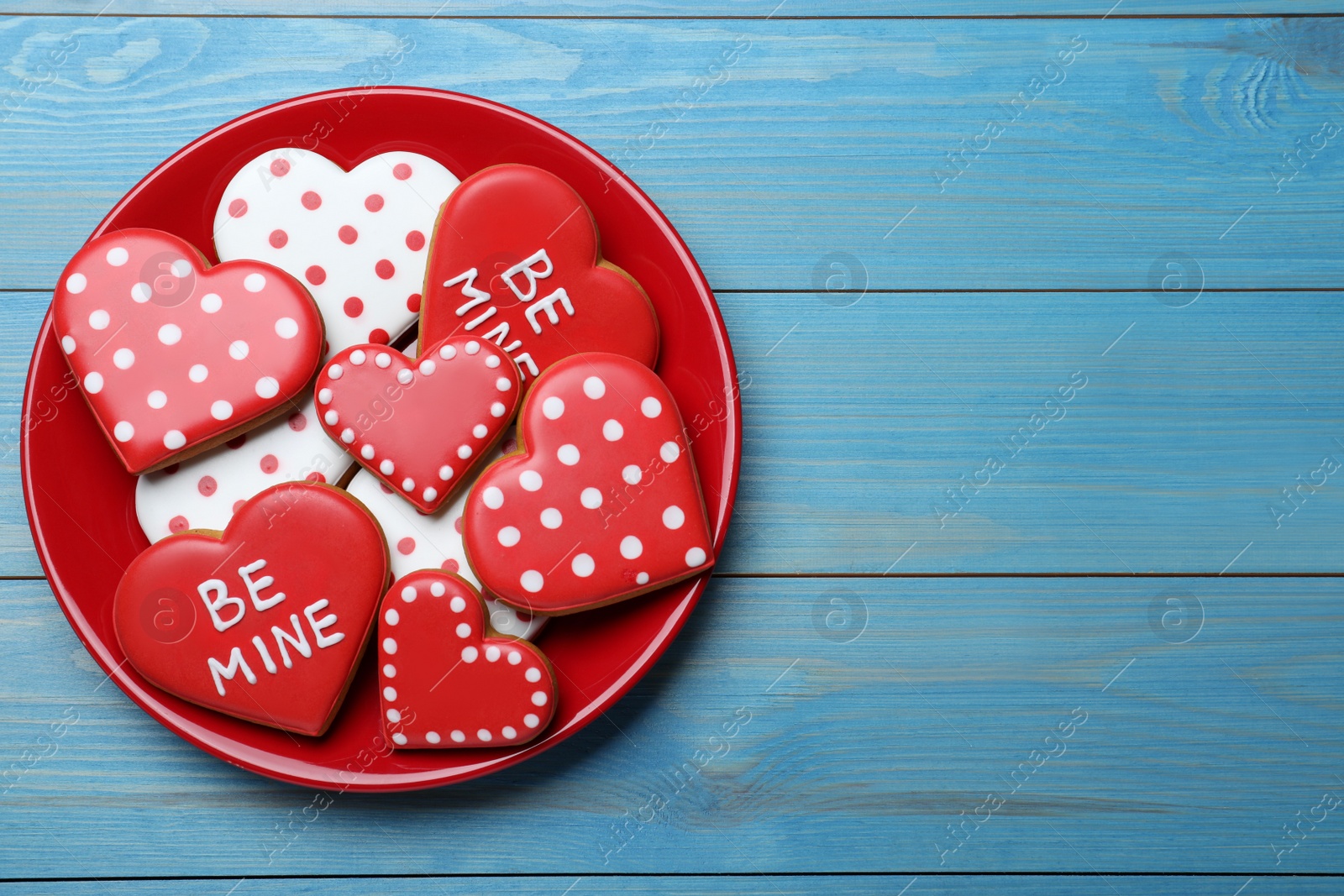 Photo of Valentine's day cookies on white wooden table, top view. Space for text