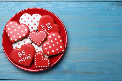 Photo of Valentine's day cookies on white wooden table, top view. Space for text