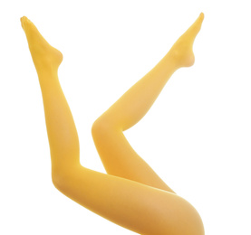 Woman wearing yellow tights on white background, closeup of legs