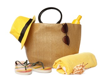 Stylish bag with beach accessories isolated on white