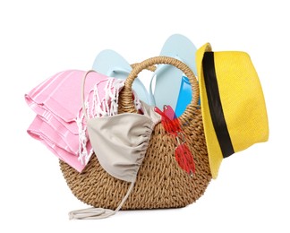 Stylish bag with beach accessories isolated on white