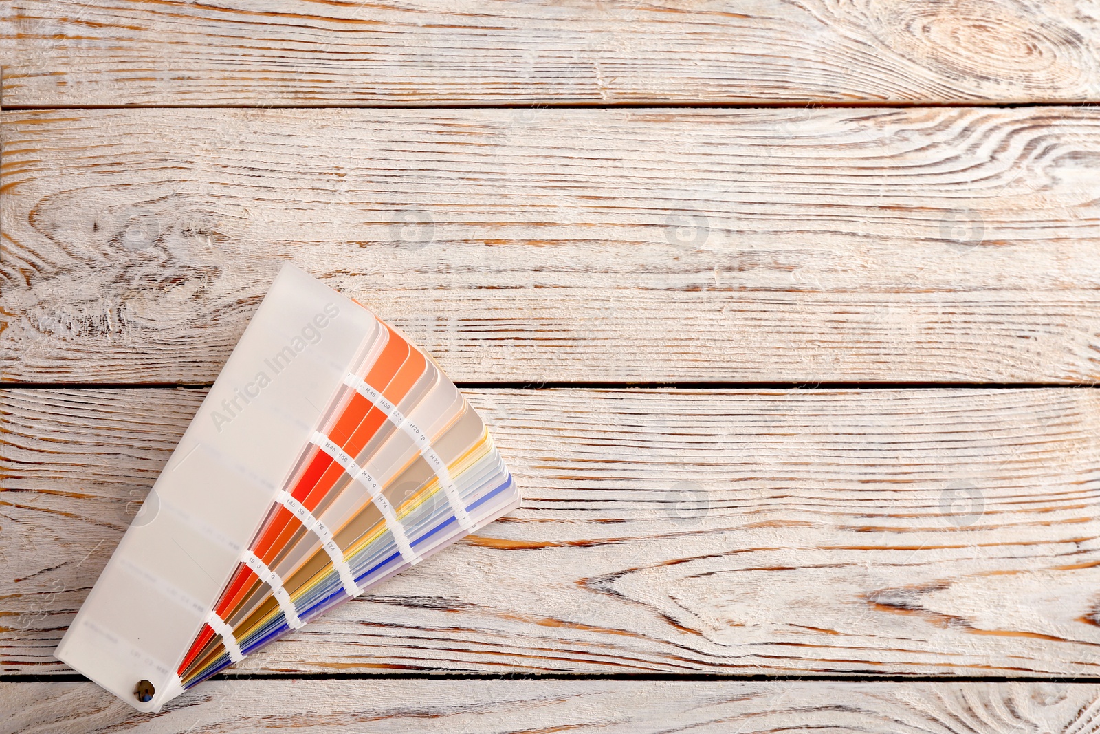 Photo of Color palette samples on wooden background