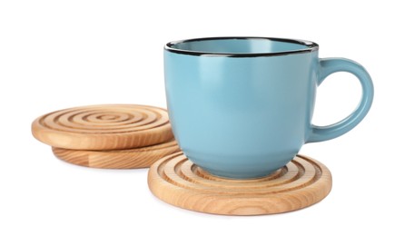 Photo of Stylish wooden coasters and cup on white background