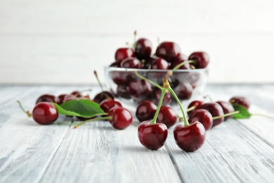 Sweet red cherries on wooden table