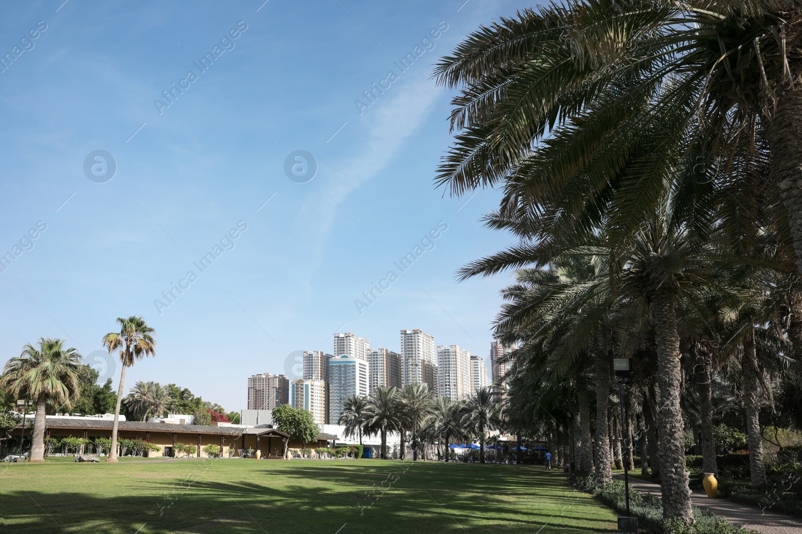 Photo of SHARJAH, UNITED ARAB EMIRATES - NOVEMBER 04, 2018: Beautiful landscape with tropical resort on sunny day