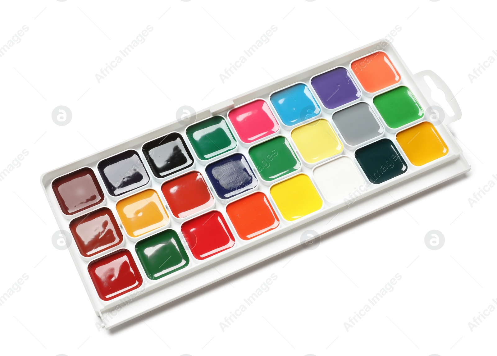 Photo of Plastic watercolor palette on white background. Painting equipment for children