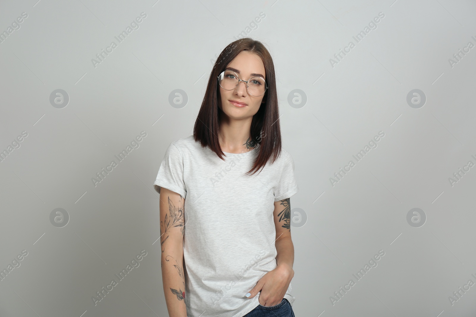 Photo of Portrait of pretty young woman with gorgeous chestnut hair on light background