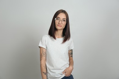 Photo of Portrait of pretty young woman with gorgeous chestnut hair on light background