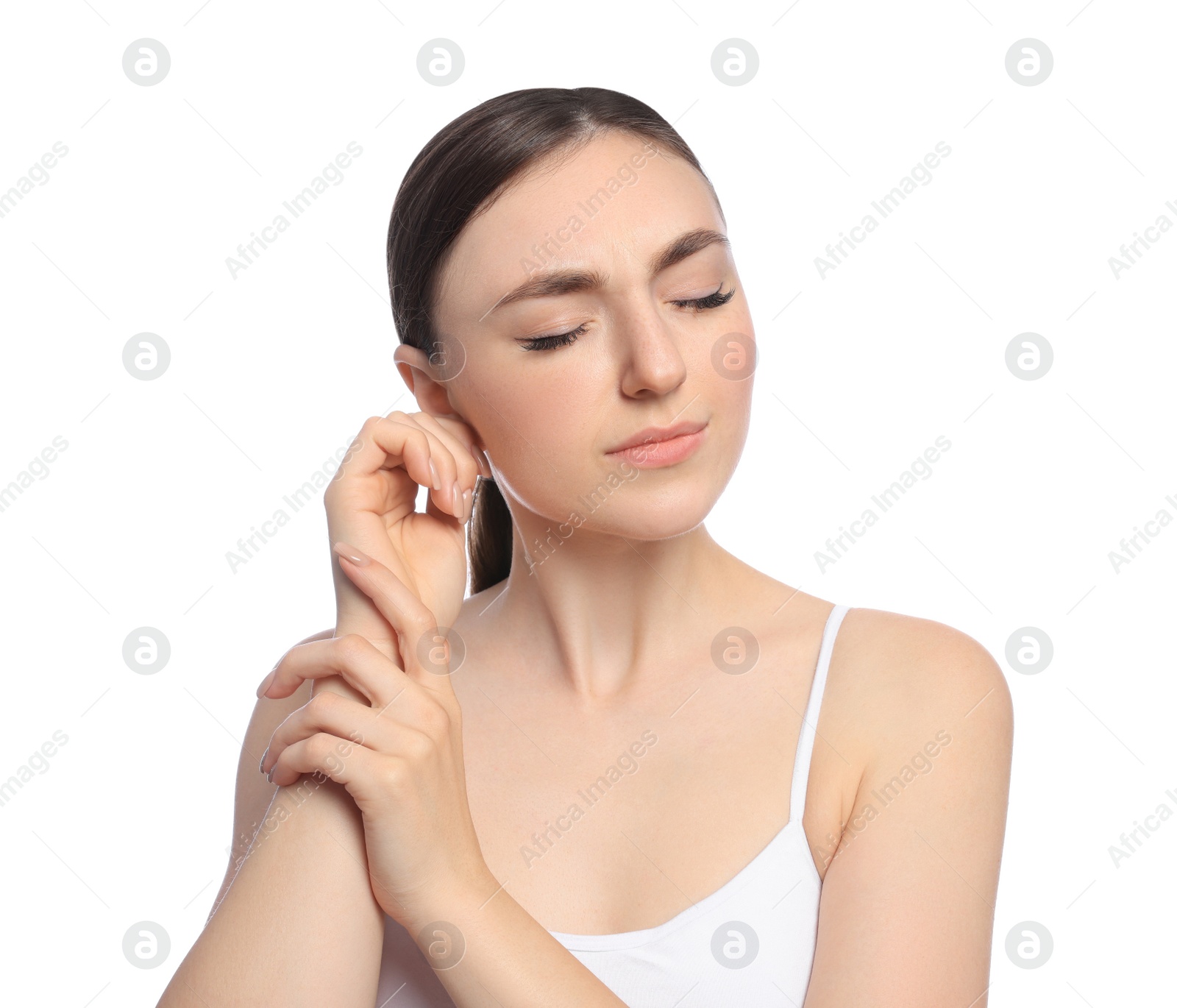 Photo of Young woman suffering from ear pain on white background