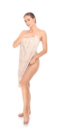 Full length portrait of young pretty woman with towel on white background