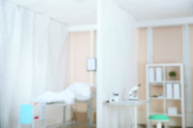 Photo of Blurred view of doctor's office interior with workplace