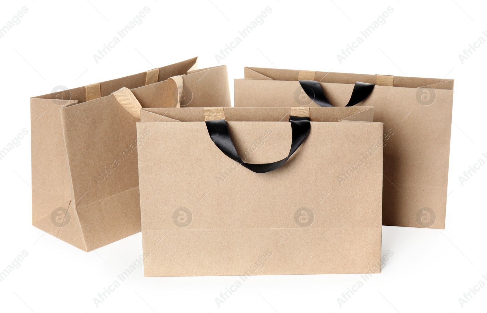 Photo of Paper shopping bags isolated on white. Mock up for design