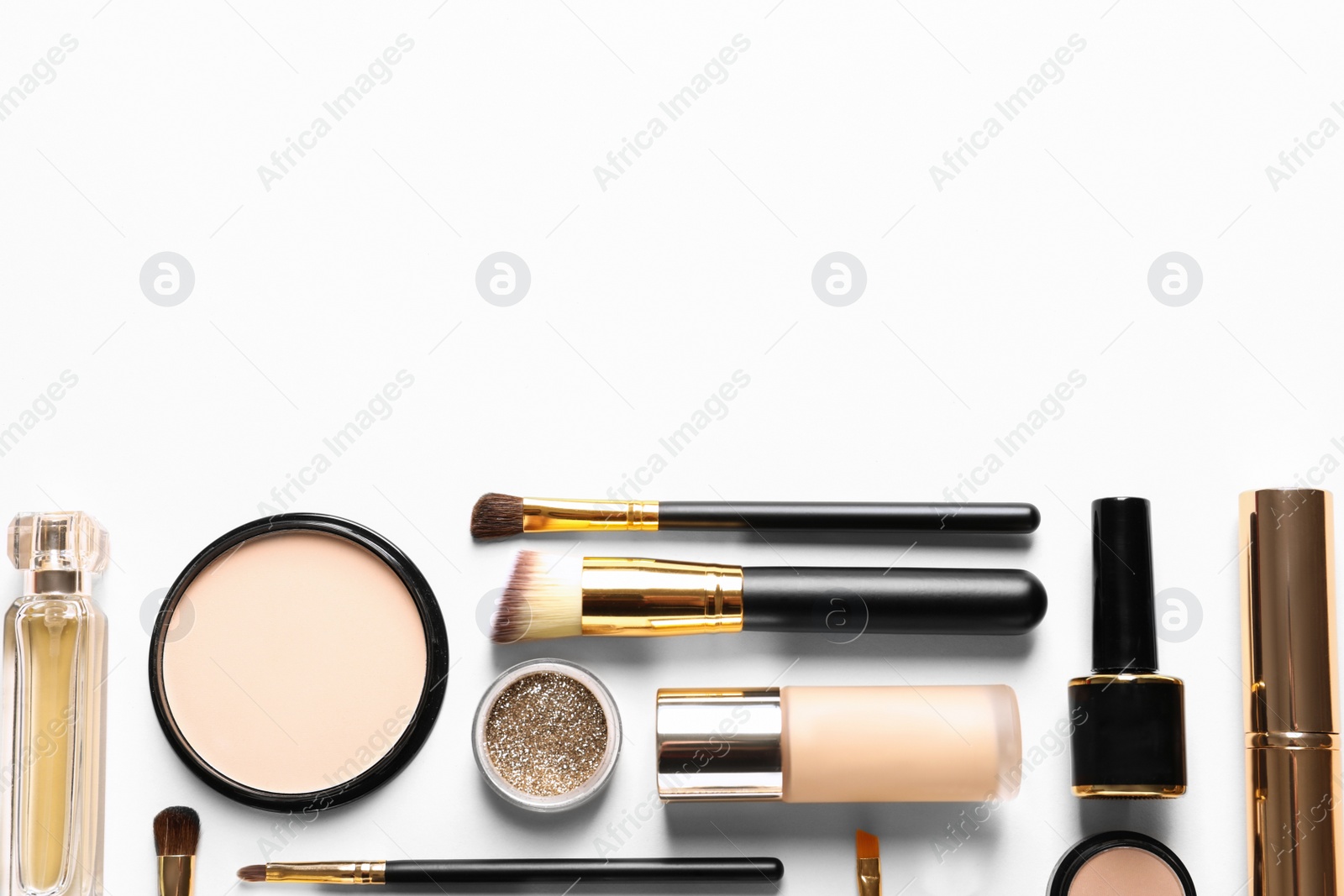 Photo of Different luxury makeup products on white background, top view