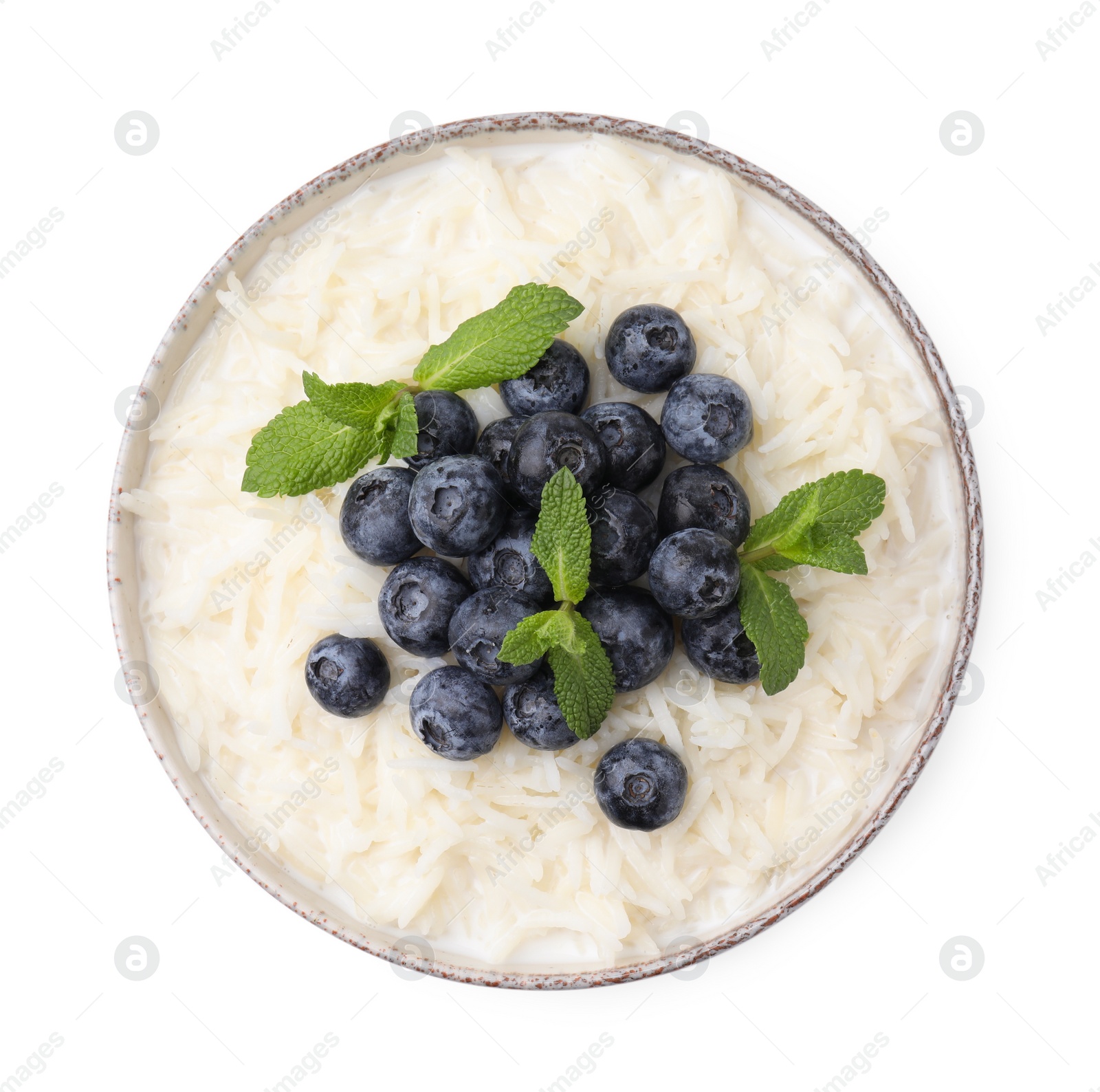 Photo of Delicious rice porridge with blueberries and mint isolated on white, top view