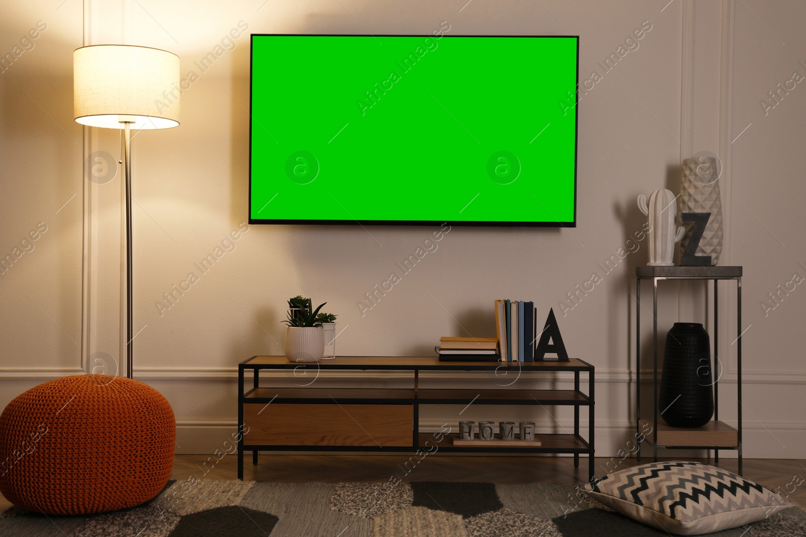 Image of Chroma key compositing. TV with mockup green screen in room. Mockup for design