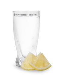 Photo of Shot of vodka with lemon slices on white background