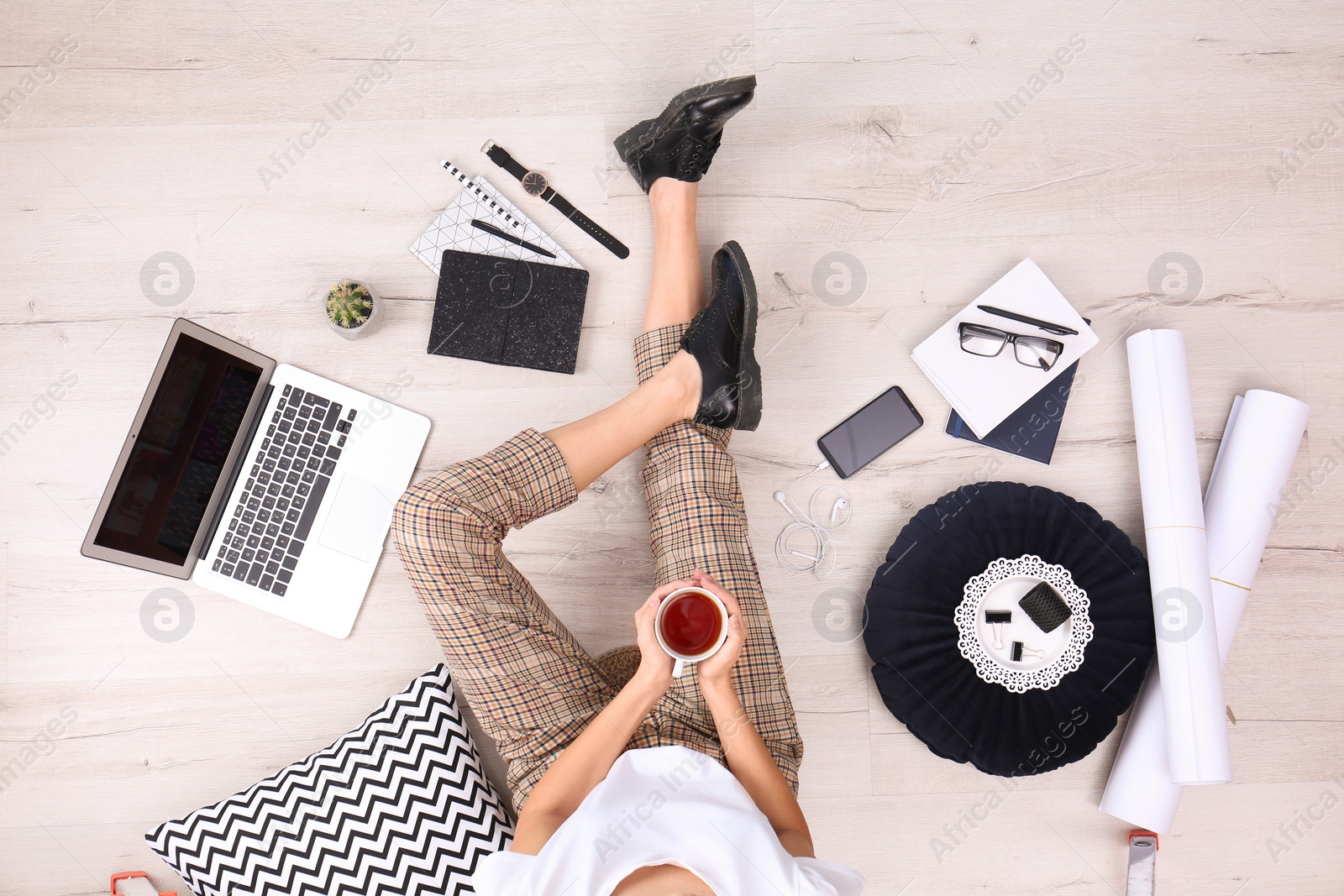 Photo of Fashion blogger with laptop sitting on floor, top view