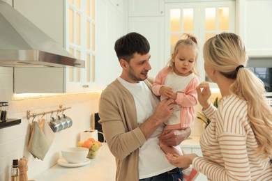 Happy family spending time together in kitchen