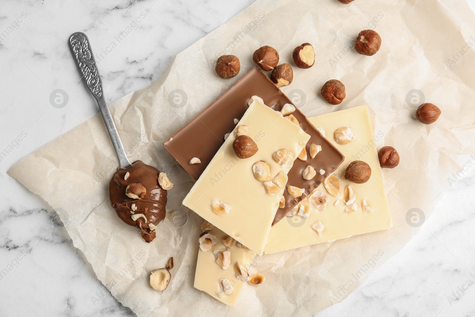 Photo of Delicious milk and white chocolate bars on table, top view