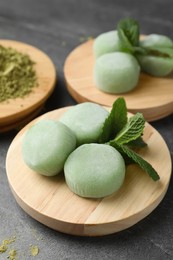 Delicious matcha mochi served on grey table