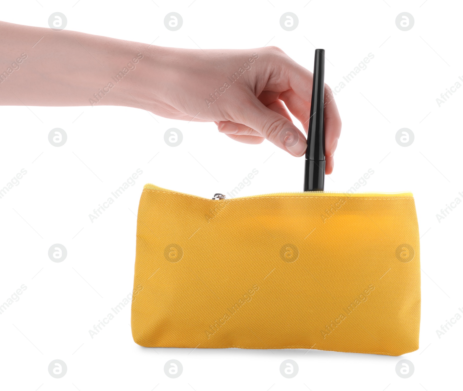 Photo of Woman taking out eyeliner from yellow cosmetic bag on white background, closeup