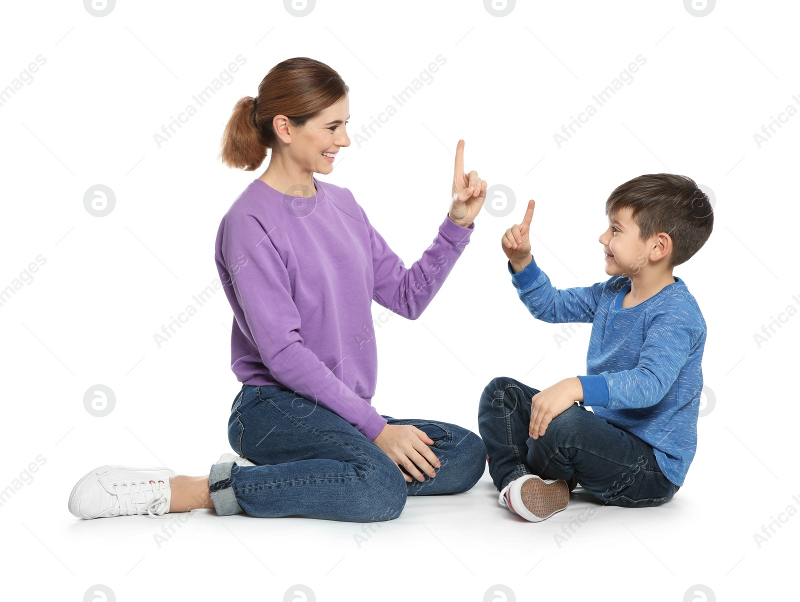 Photo of Hearing impaired mother and her child talking with help of sign language on white background