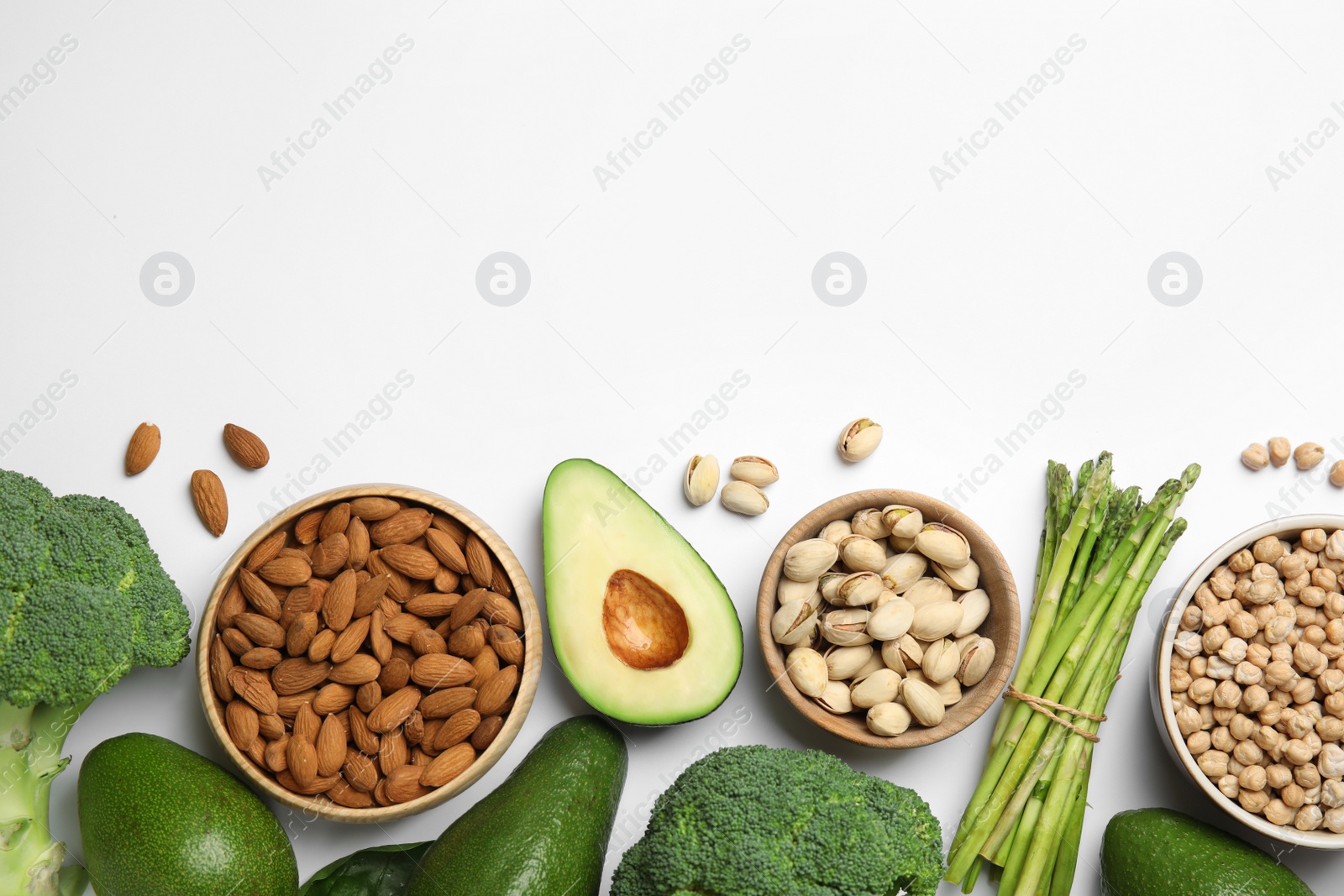 Photo of Top view of different products rich in vitamin E on white background