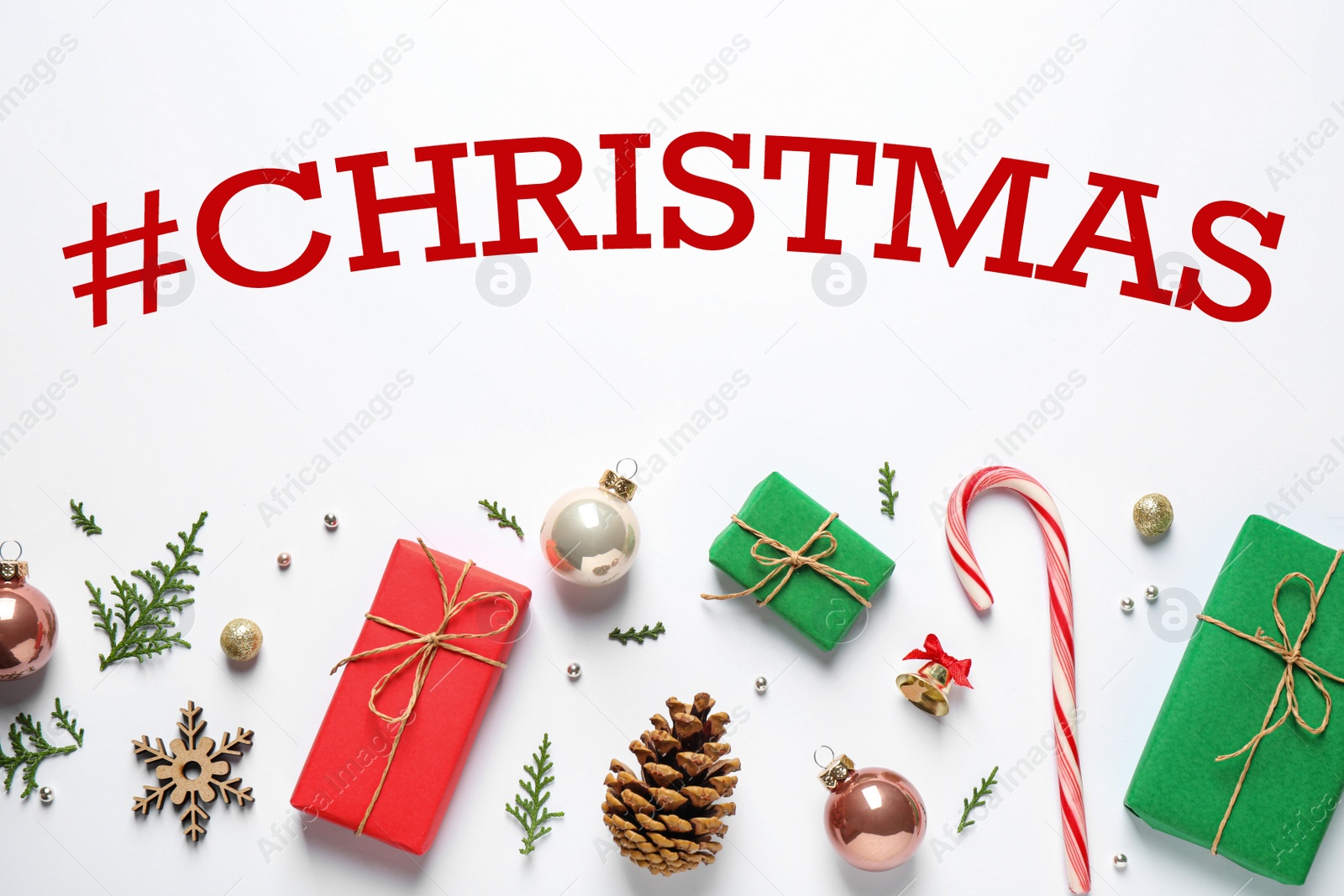 Image of Hashtag Christmas, gift boxes and festive decor on white background, flat lay