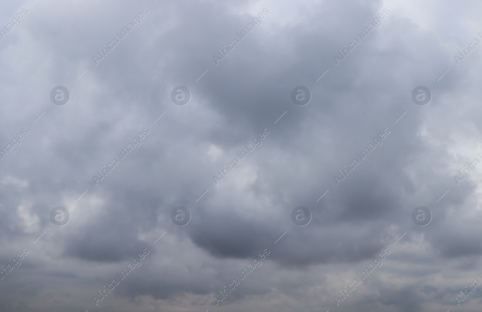 Photo of Sky with heavy rainy clouds on grey day