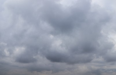 Photo of Sky with heavy rainy clouds on grey day