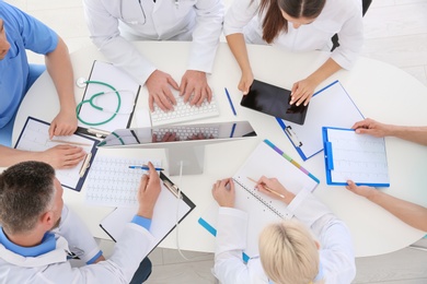 Photo of Group of doctors attending meeting in clinic. Cardiology conference