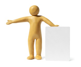 Photo of Yellow plasticine human figure with blank card isolated on white, space for text