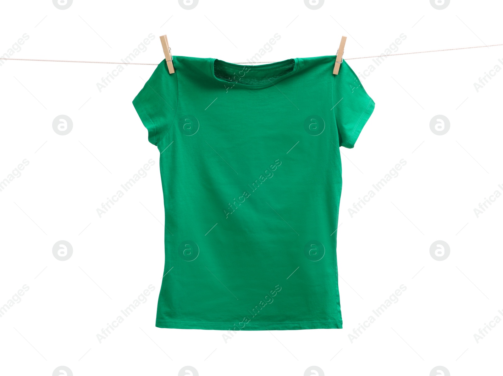 Photo of One green t-shirt drying on washing line isolated on white