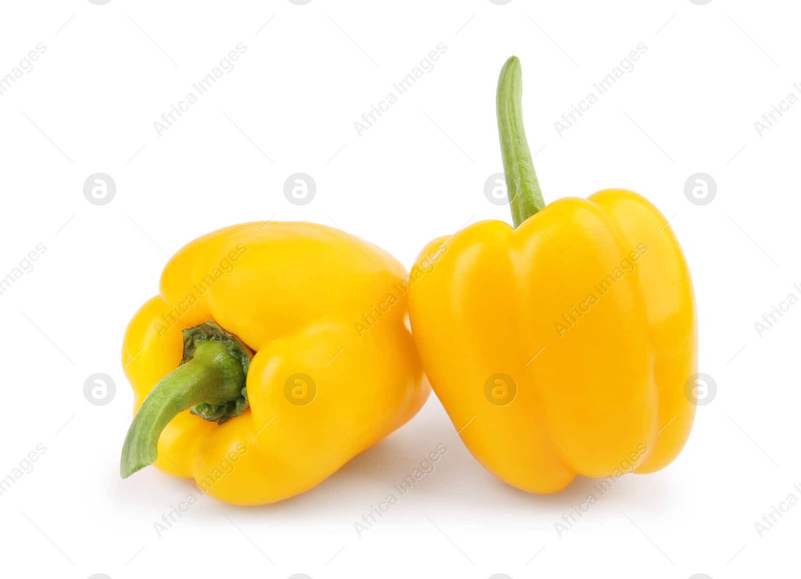 Photo of Ripe yellow bell peppers isolated on white