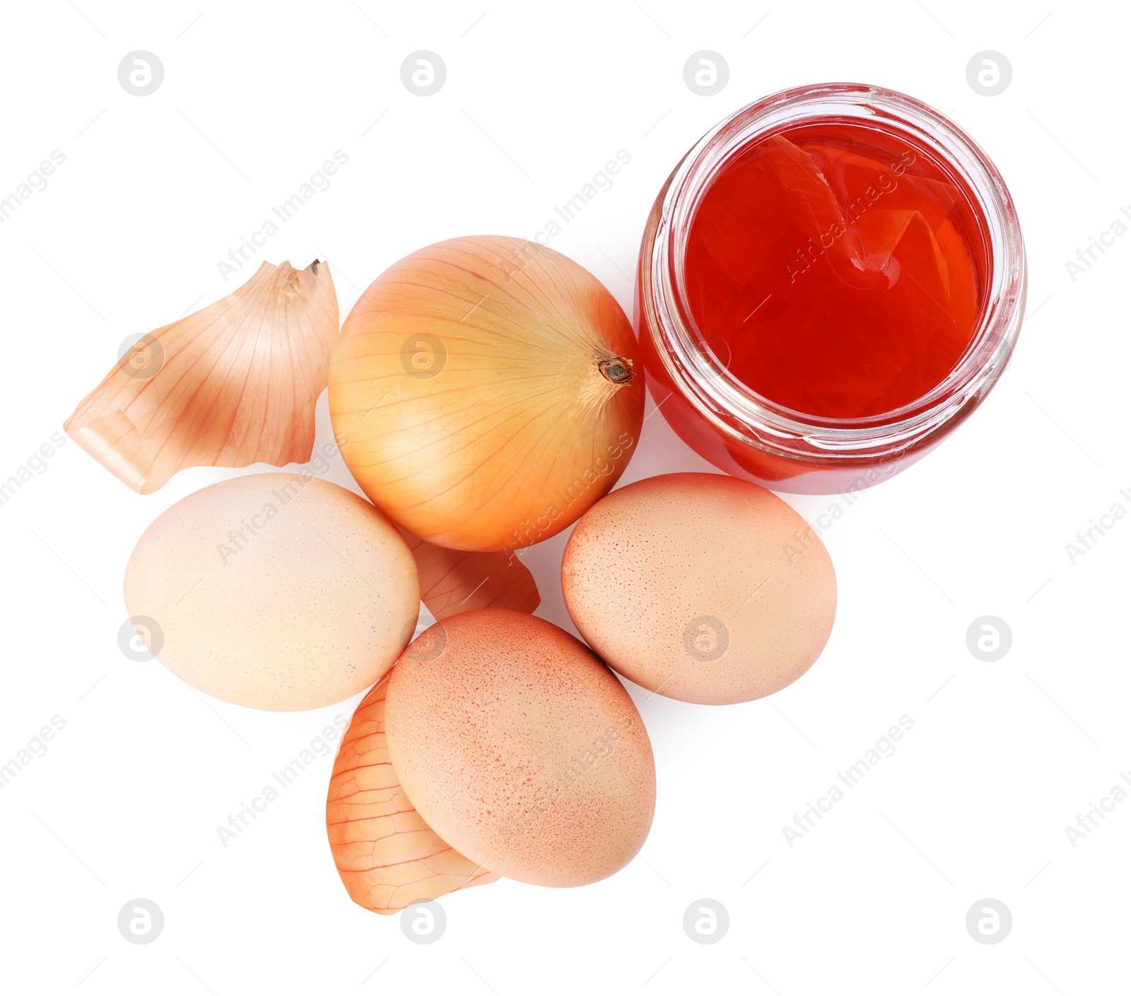 Photo of Easter eggs painted with natural dye and onion on white background, top view